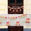 Nestaariya Floral Bliss Toran with pink, white, yellow flowers and pearl hangings – festive door bandanwar for main doors and pooja rooms